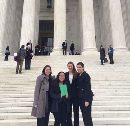 Students and staff in front of Supreme Court building